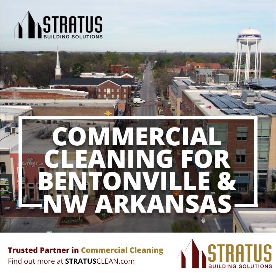 Downtown Bentonville from a drone perspective in the afternoon with the text "Commercial Cleaning now in Bentonville" with Stratus Logo in the footer.